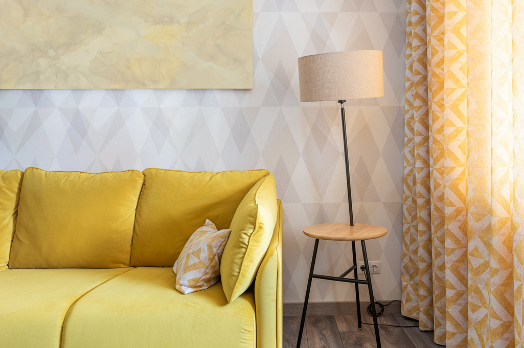 yellow leather couch in bright living room