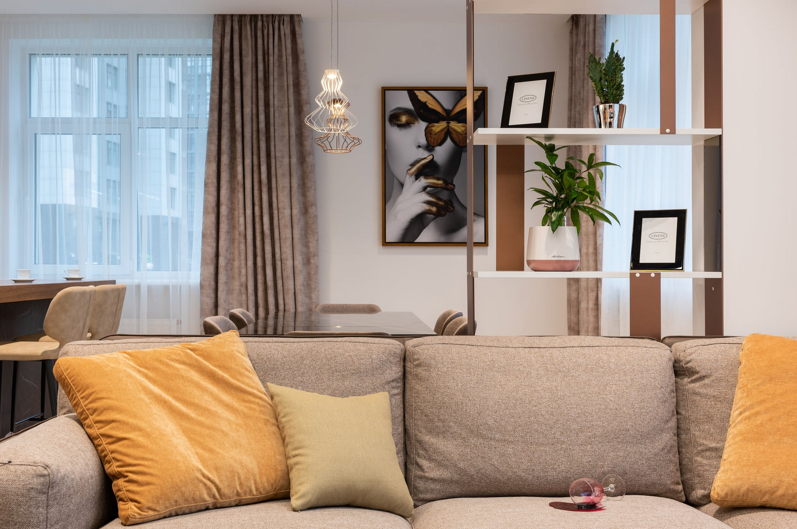 tan couch with spilled glass of red wine