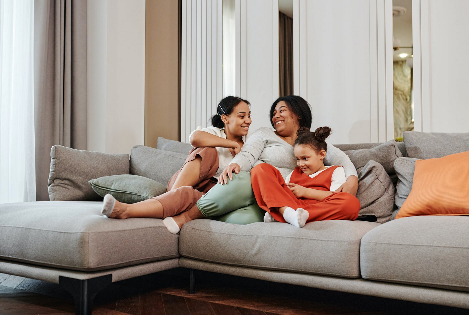 family relaxing on a modular sofa