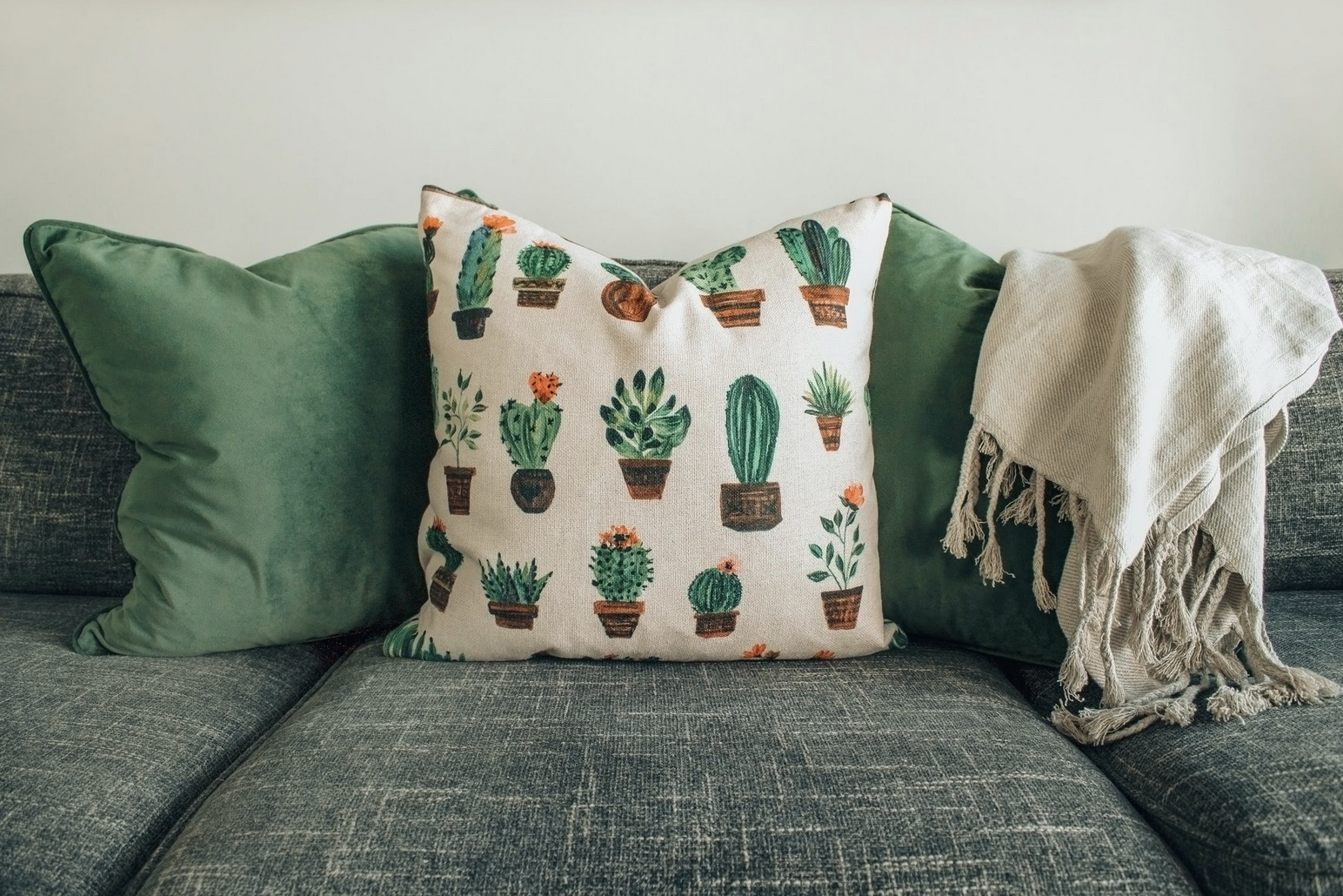 green couch cushions and pillows